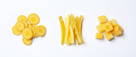 Cut raw yellow carrot on white background, top viewの写真素材