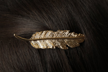 Woman with beautiful gold hair clip, closeup