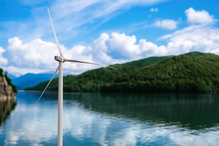 alternative energy sources. wind turbine near mountainsの写真素材