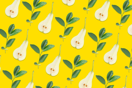 Pattern of pear halves and leaves on yellow background