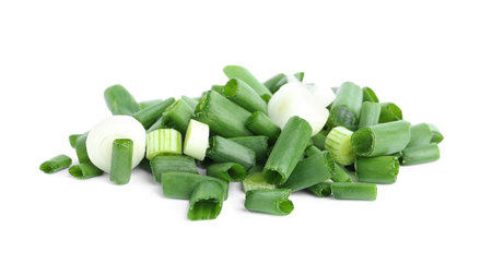 Cut green spring onion isolated on whiteの写真素材