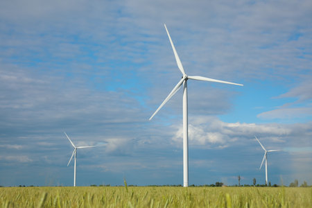 Beautiful view of field with wind turbines. Alternative energy source