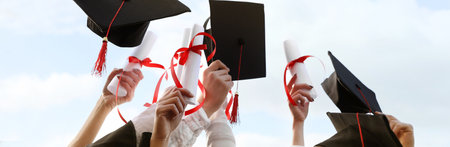Group of students with diplomas outdoors, closeup. banner designの写真素材