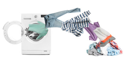 Washing machine and flying clothes on white background, banner designの写真素材