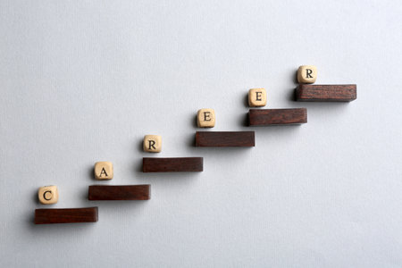 Wooden beads with word CAREER on steps, flat lay. business promotion