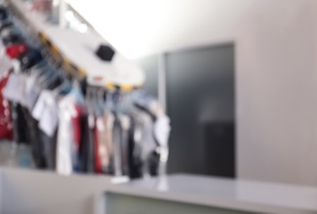 Blurred view of dry-cleaner's interior with garment conveyorの写真素材