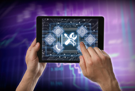 Man using tablet on color background, closeup. technical support
