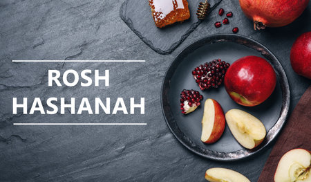 Honey, apples and pomegranates on black table, flat lay. Rosh Hashanah holidayの写真素材