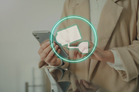 Woman using CCTV app on smartphone indoors, closeup