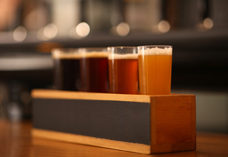 Beer tasting set on wooden bar counterの写真素材