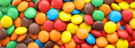 Many colorful candies as background, top view. banner design