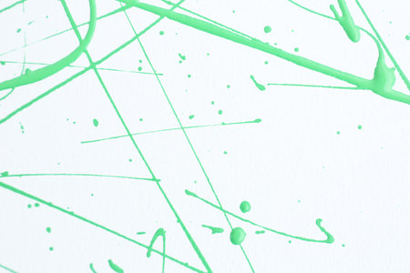 Green paint splashes on white canvas as background. Art and creativityの写真素材