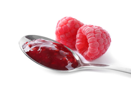Delicious jam and fresh raspberries isolated on white