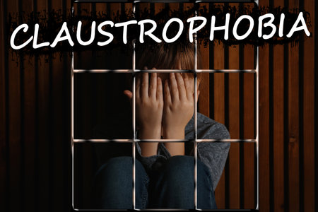 claustrophobia. Scared little girl feeling in closed space and cryingの写真素材