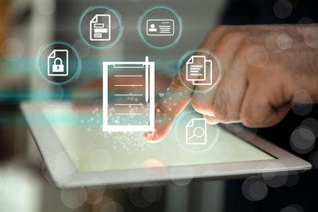 Man using tablet indoors and document icons, closeupの写真素材