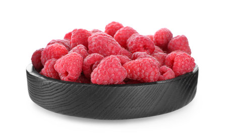 Delicious fresh ripe raspberries in wooden bowl isolated on white