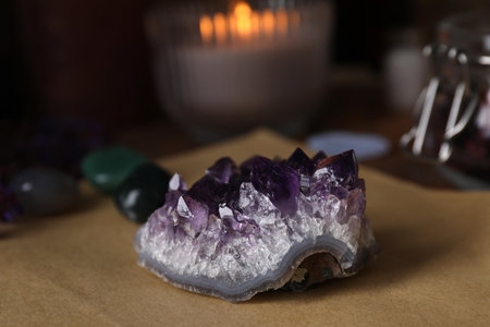 Composition with healing amethyst gemstone on table, closeupの写真素材