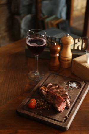 Tasty roasted meat served on wooden table in restaurant. cooking foodの写真素材