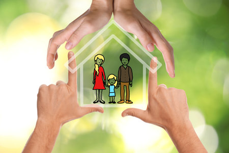 People forming house with their hands and illustration of family on blurred green background, closeupの写真素材