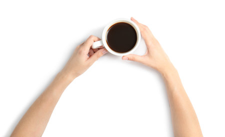 Woman holding cup of coffee on white background, top viewの写真素材