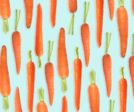 Whole carrots on light blue background. pattern designの写真素材