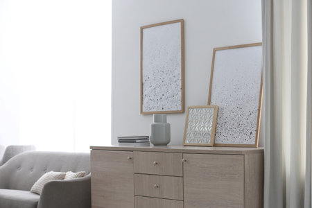 Modern room interior with stylish chest of drawers