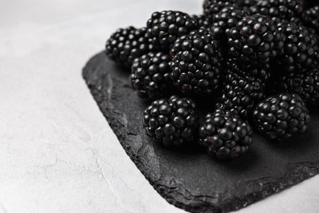 Fresh ripe blackberries on white table, closeupの写真素材