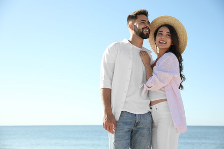 Happy young couple at the beach. Honeymoon tripの写真素材