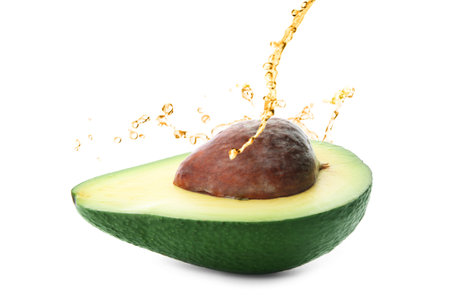 Avocado oil and fresh fruit on white backgroundの写真素材