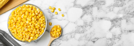 Delicious canned corn in bowl and space for text on marble table, flat lay. Banner designの写真素材