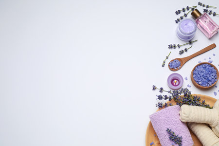 Composition with lavender flowers and natural cosmetic products on white background, top viewの写真素材
