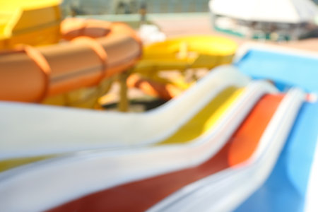 Blurred view from colorful slides in water park