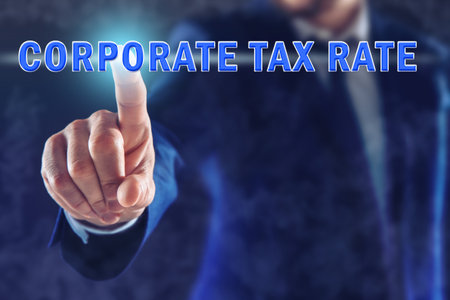 corporate tax rate. Man touching virtual screen on color background, closeupの写真素材