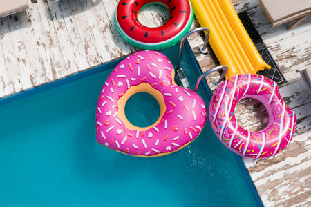 Above view of inflatable rings and swimming pool. summer holidaysの写真素材
