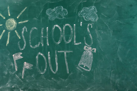 Text School's Out and drawings on green chalkboard. summer holidaysの写真素材