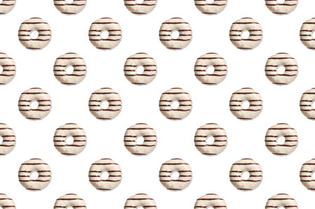 Creative pattern design of glazed donuts on white backgroundの写真素材