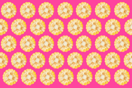 Collage with corn cob pieces on pink background, pattern design