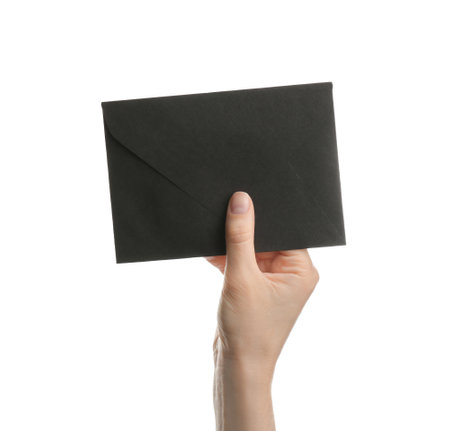 Woman holding black paper envelope on white background, closeupの写真素材