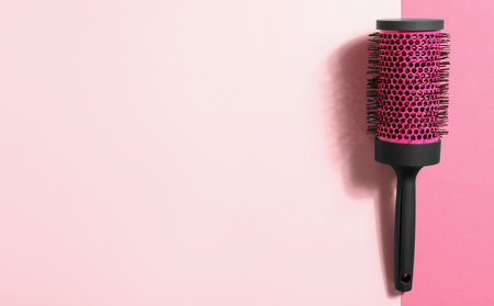 Round hair brush on color background, top view. Space for textの写真素材