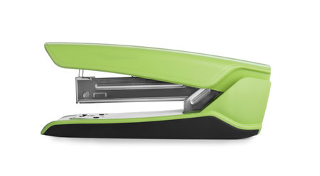 Green stapler isolated on white. Stationery for school