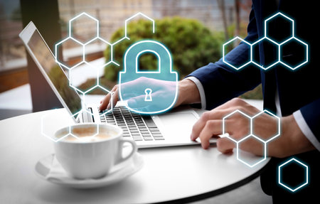 Cyber attack protection. Businessman working with laptop, closeup. lock illustration