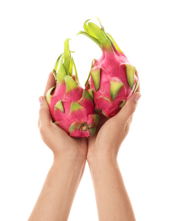 Woman holding ripe dragon fruits (pitahaya) on white background, closeupの写真素材