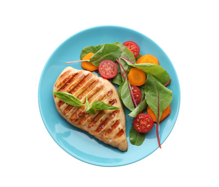 Tasty grilled chicken fillet with green basil and vegetables isolated on white, top viewの写真素材