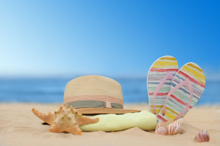 Different beach objects on sand near seaの写真素材