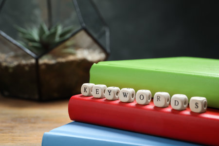 Beads with word KEYWORDS on notebooks, closeupの写真素材