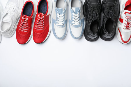 Many stylish sneakers on white background, top viewの写真素材