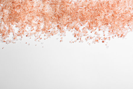 Pink himalayan salt isolated on white, top view