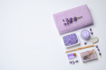Cosmetic products and lavender flowers on white background, flat layの写真素材