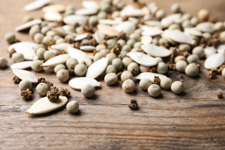 Mixed vegetable seeds on wooden background, closeupの写真素材