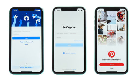 MYKOLAIV, UKRAINE - JULY 07, 2020: New modern iPhone 11 with Facebook, Instagram and Pinterest apps on screens against white backgroundのeditorial素材